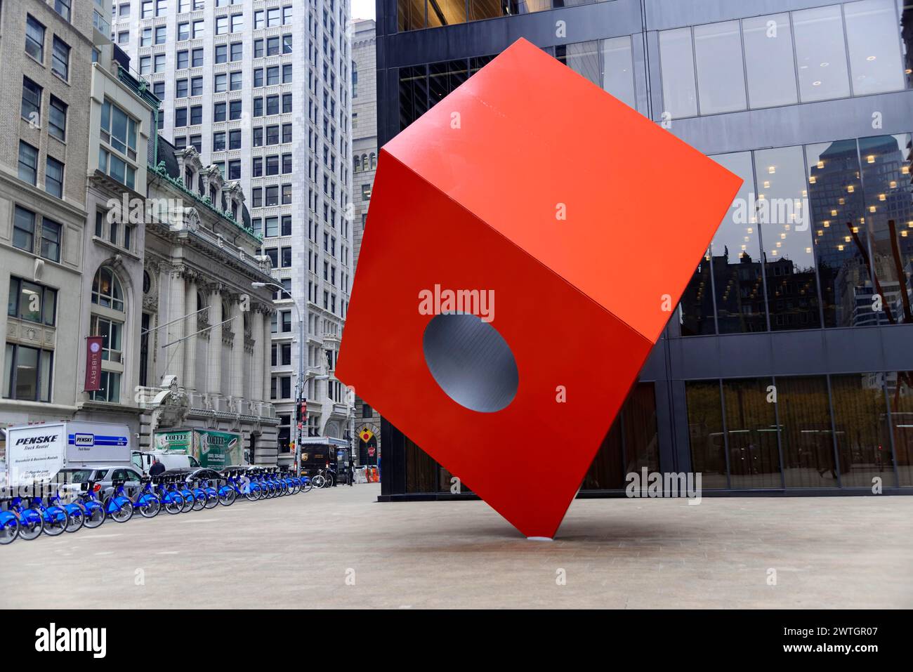 Geometric red sculpture with circular cut-out in front of modern building, Manhattan, New York City, New York, USA, North America Stock Photo