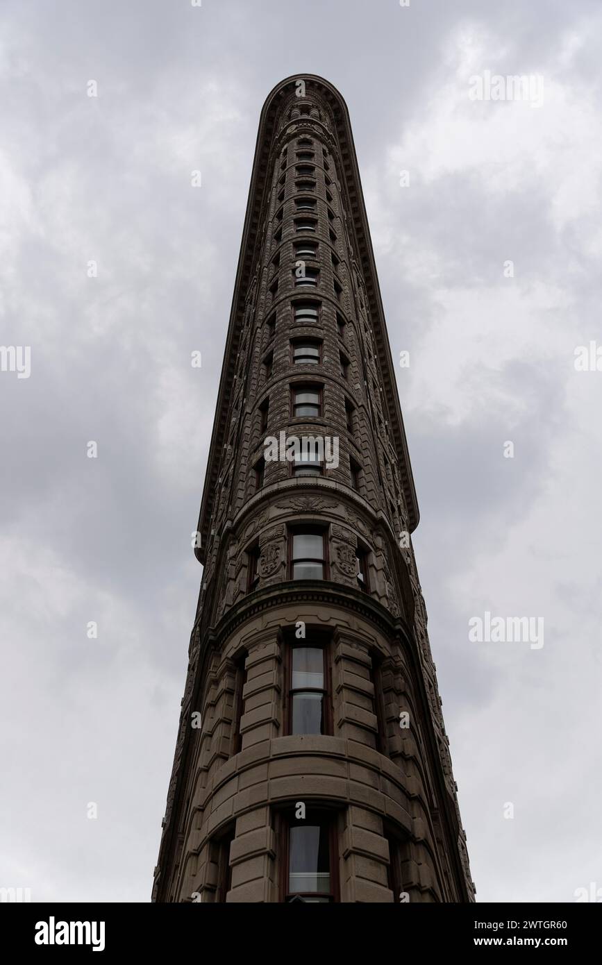 The iconic Flatiron building against a cloudy sky in monochrome colours, Manhattan, New York City, New York, USA, North America Stock Photo