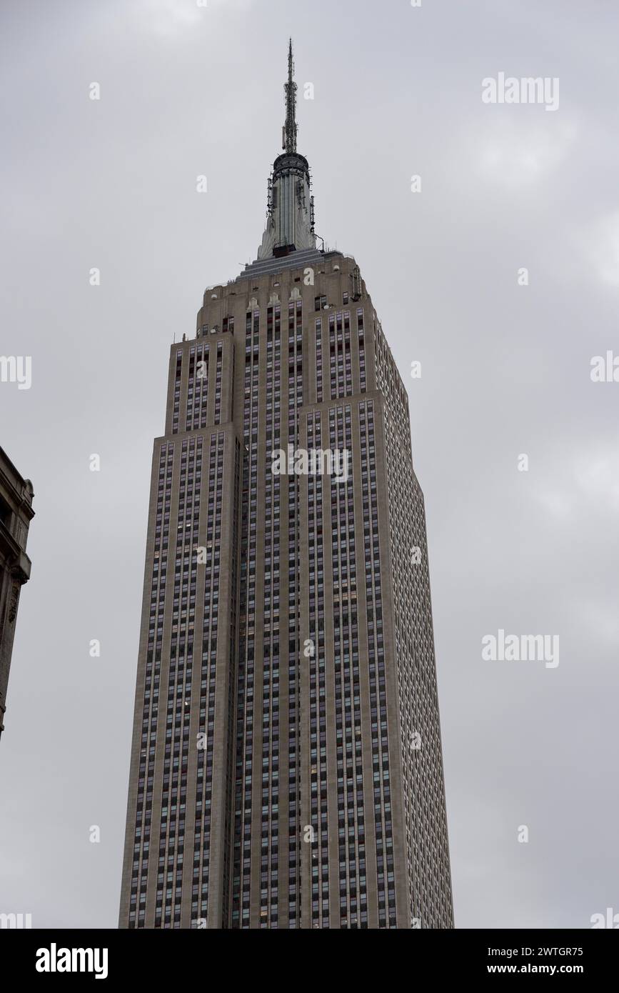 Empire State Building New York City, View of a tall Art Deco-style building under a cloudy sky, Manhattan, New York City, New York, USA, North America Stock Photo