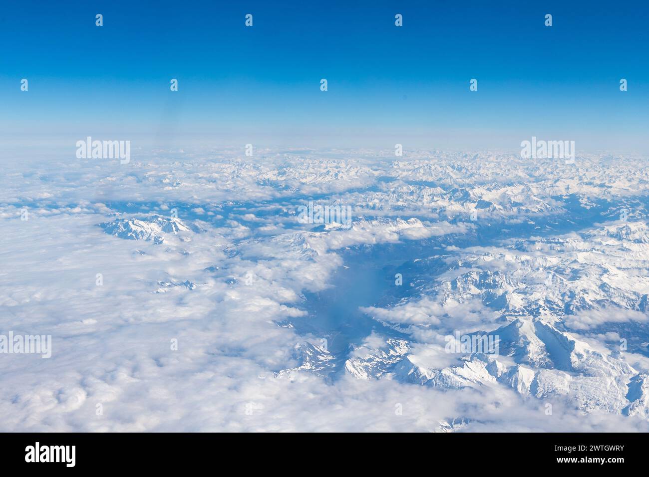 An aerial view of the Alps, a European mountain range and also the highest and most extensive mountain range that is entirely in Europe, stretching ap Stock Photo