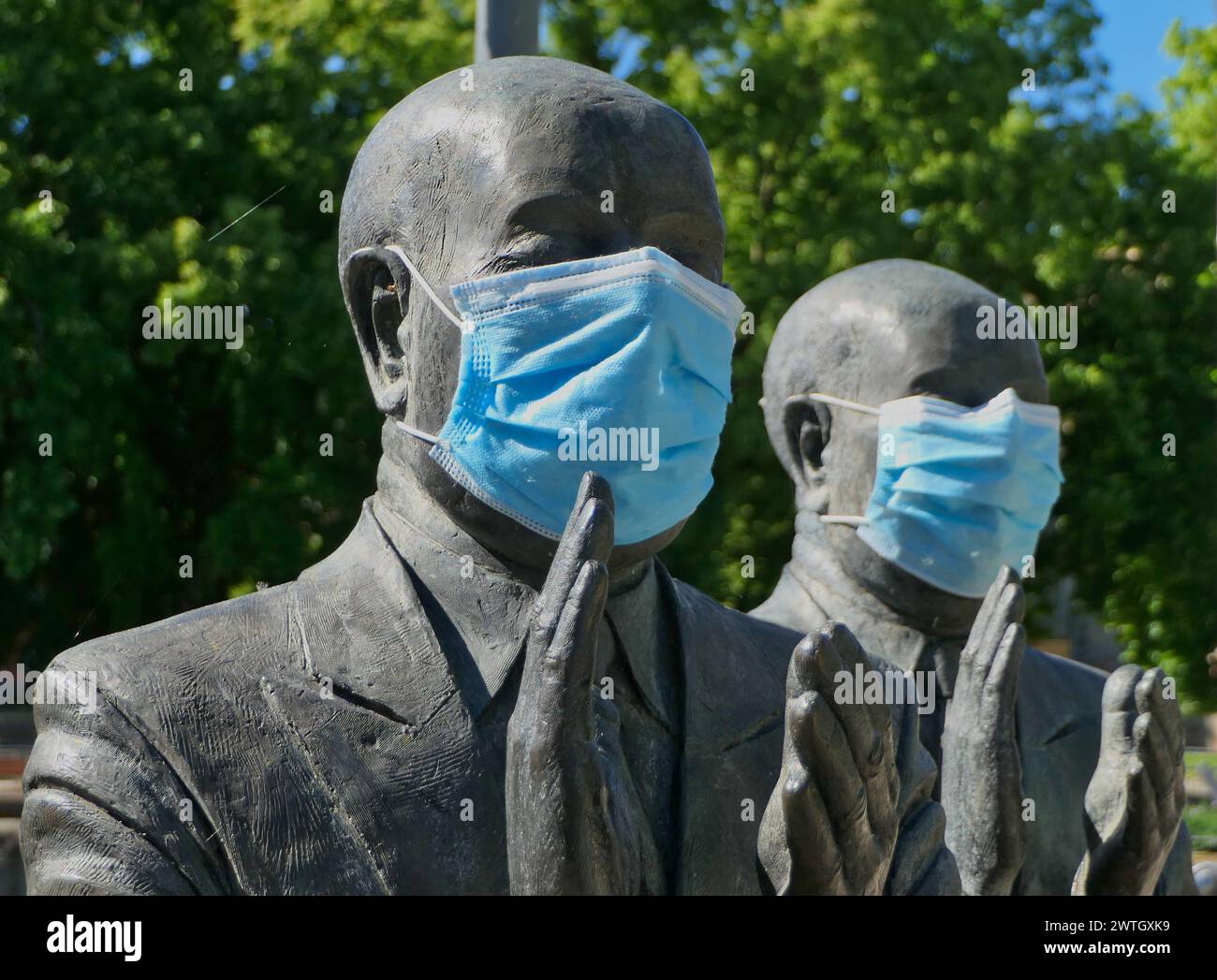 Metal sculptures in Pforzheim, Germany, featuring masks during the Corona pandemic Stock Photo