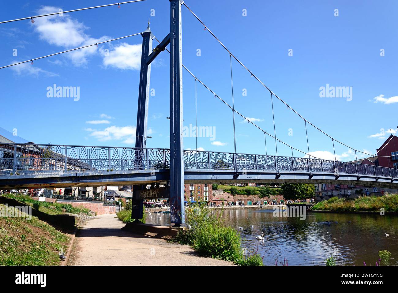 View of the Cricklepit suspension bridge over the River Exe with ...