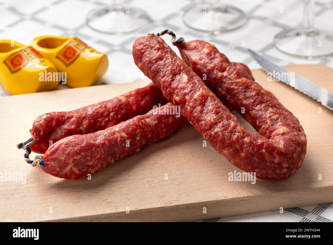Traditional Dutch Metworst, preserved pork sausage, on a cutting board close up Stock Photo