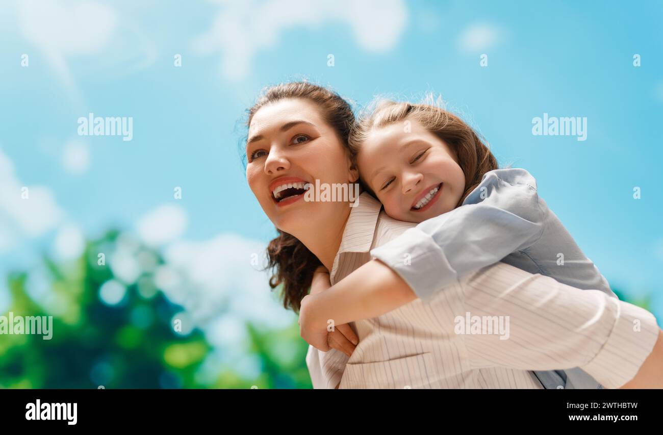 Happy family at nature. Mother and child are having fun and enjoying summer days. Stock Photo