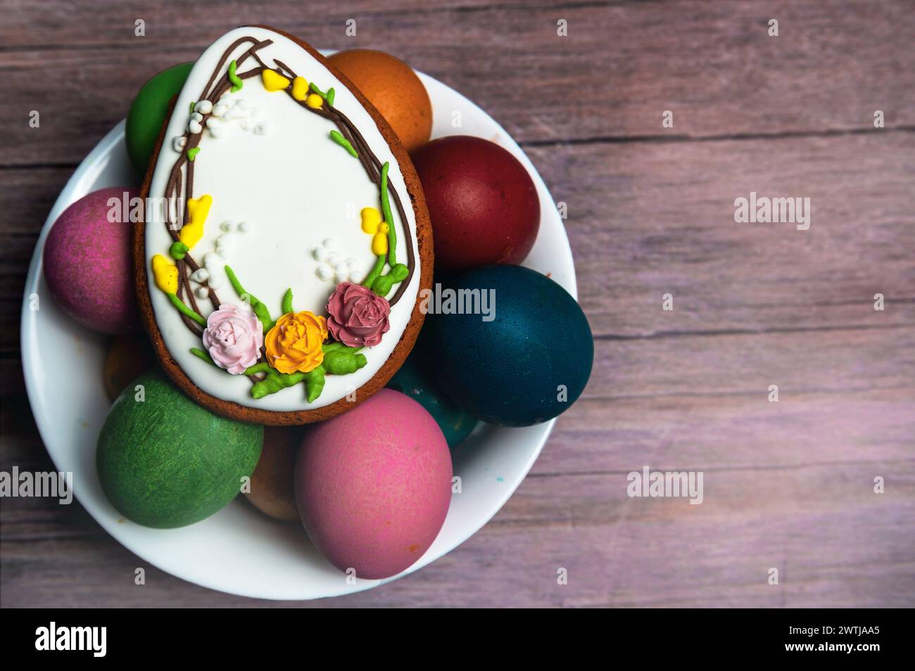 Easter gingerbread cookie on  wooden table. Egg shaped cookies for Easter Stock Photo