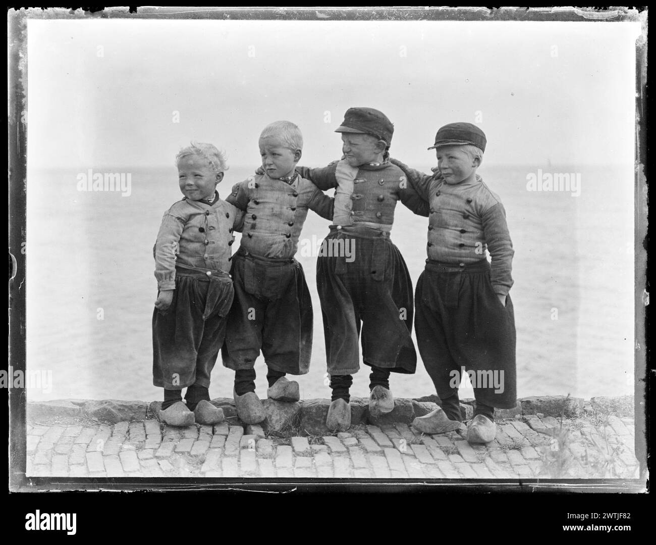 Four boys, the Netherlands gelatin dry plate negatives, black-and-white negatives, group portraits Stock Photo