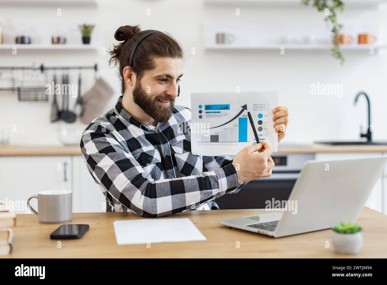Caucasian worker providing statistical analysis using modern technologies. Stock Photo