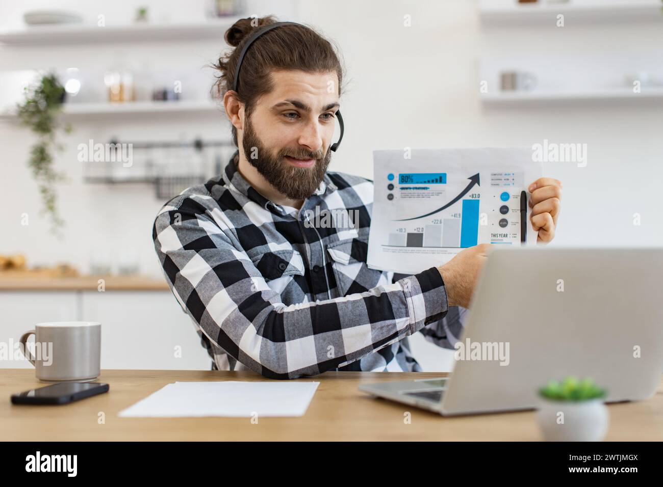 Caucasian worker providing statistical analysis using modern technologies. Stock Photo
