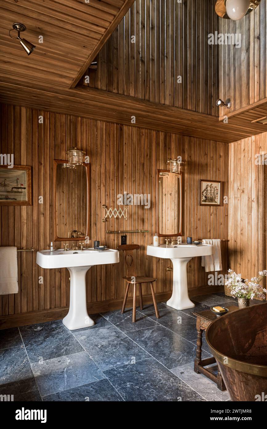 Wood cladding surrounds pair of basins in luxury hotel in Ardfin on the Isle of Jura, Inner Hebrides, Scotland, UK Stock Photo