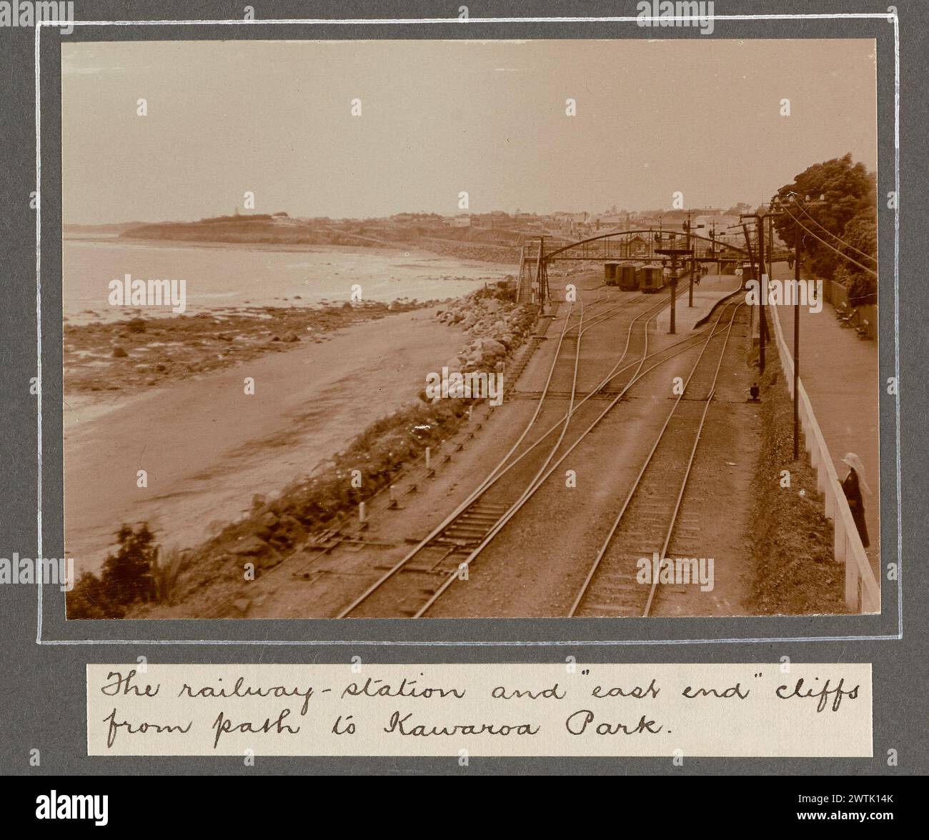 Our honeymoon at charming New Plymouth. December 14-20, 1915: The railway-station and 'east end' cliffs from path to Kawaroa Park. From the album: Family photographs. [1914-1917] photographic prints, gelatin silver prints Stock Photo