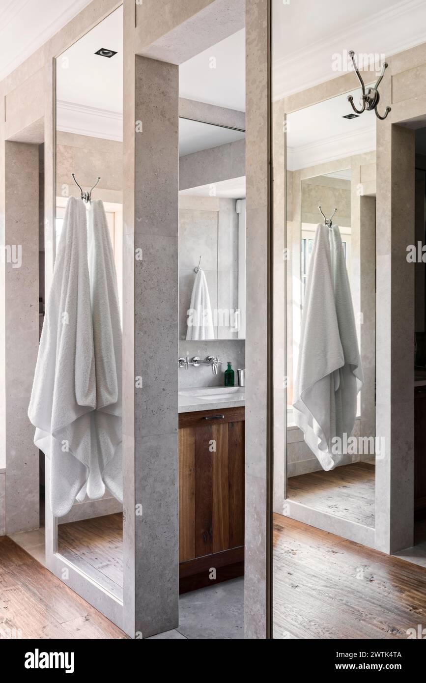 Towel hanging from bathroom partition in Irish home, Greystones, County Wicklow, Ireland. Stock Photo
