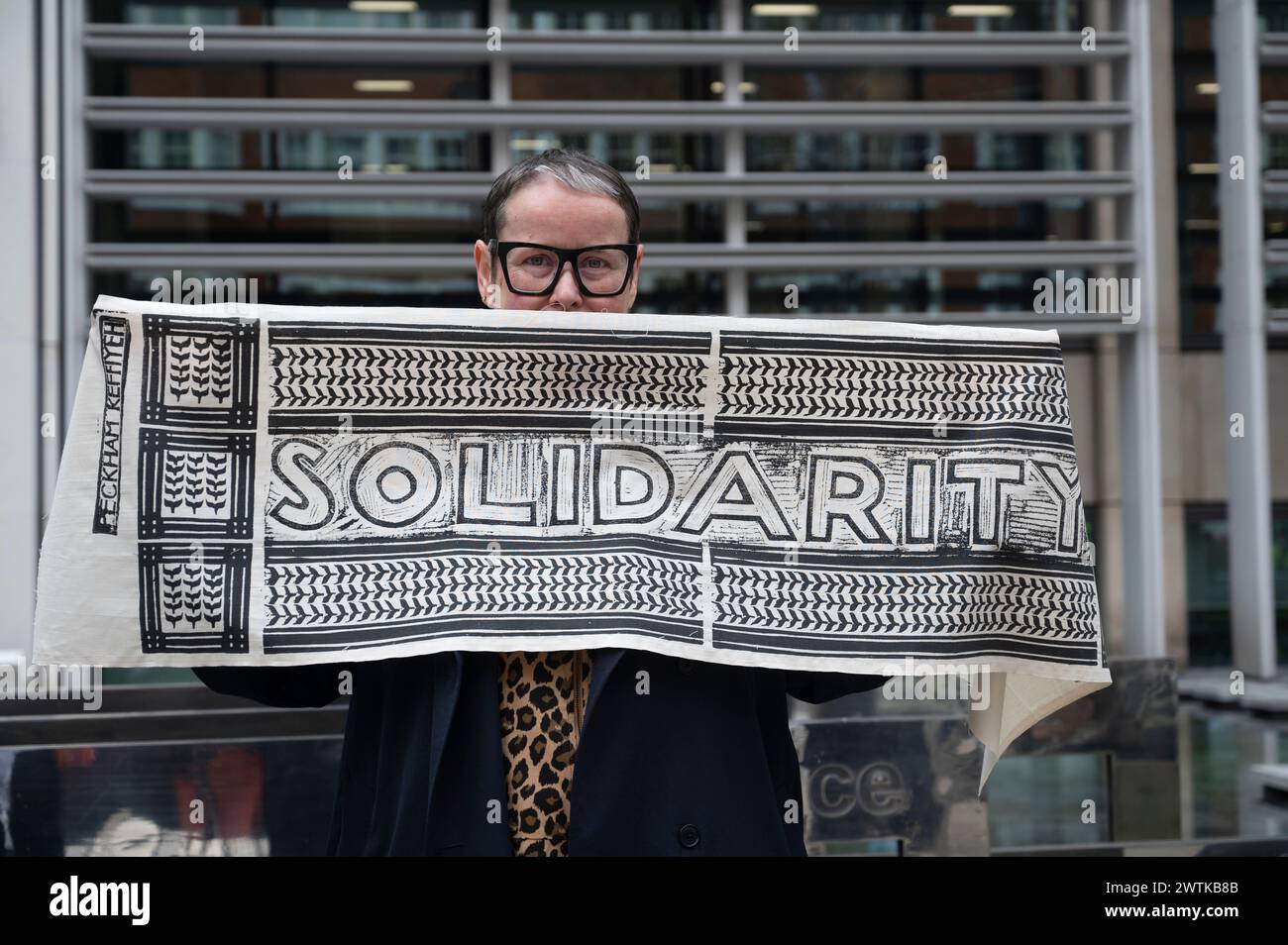 UN Day of Action against racism. 'Solidarity' scarf printed by Peckham Keffiyeh to raise money for MAP (Medical Aid for Palestine) Stock Photo