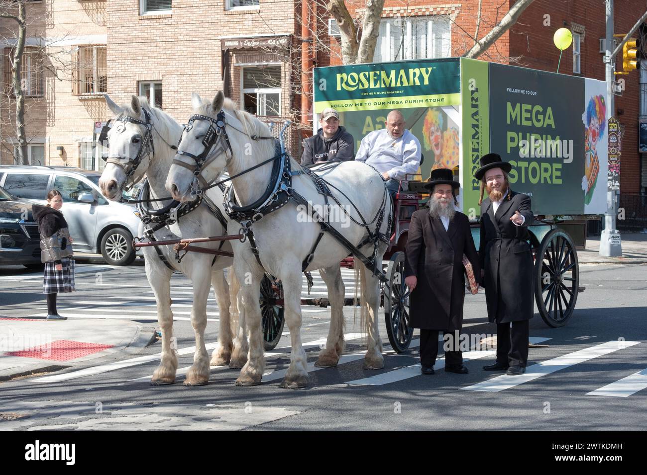2 Hasidic men pose for a photo near a horse & carriage advertising