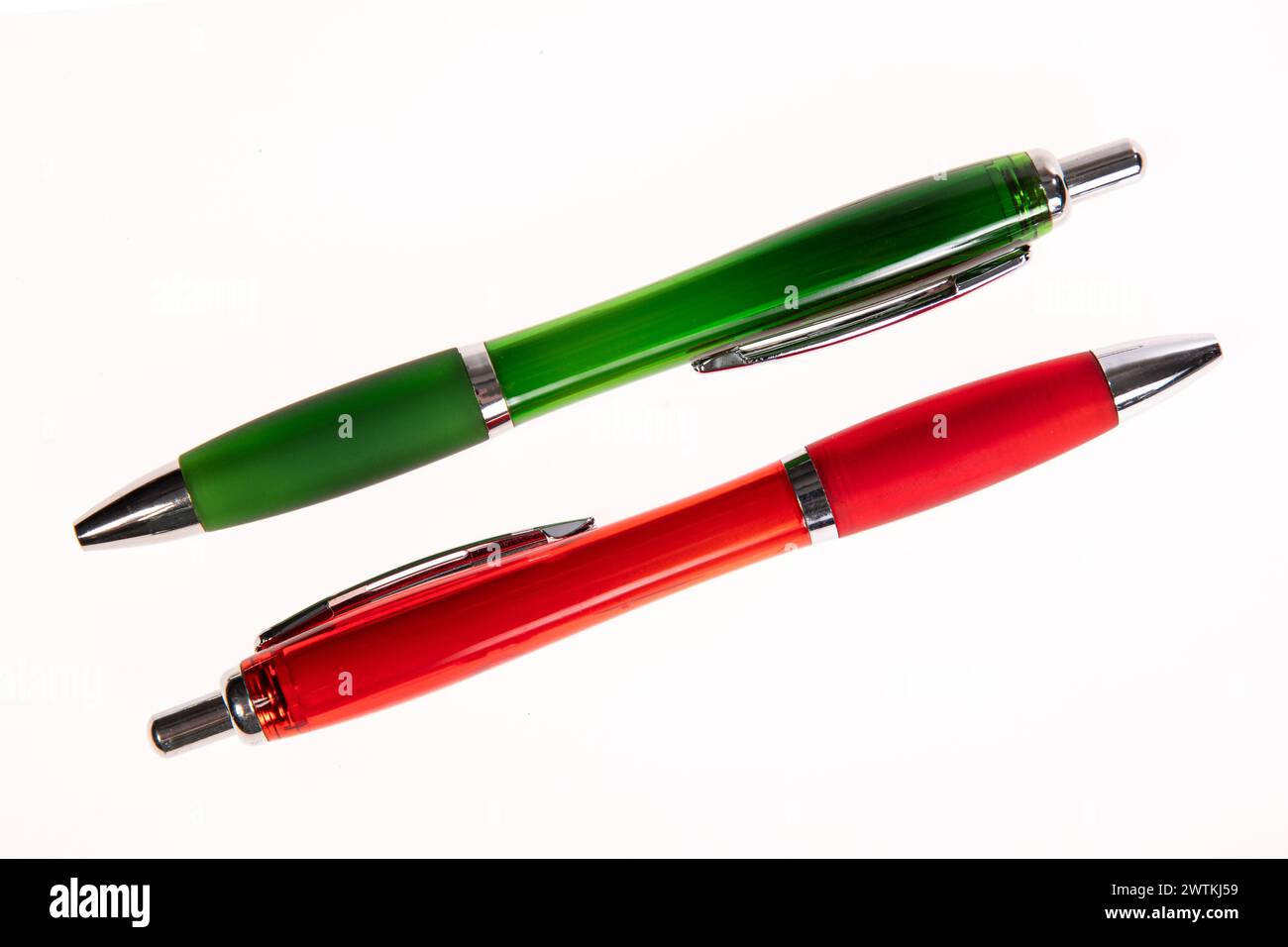 red and green pen on a white background Stock Photo - Alamy