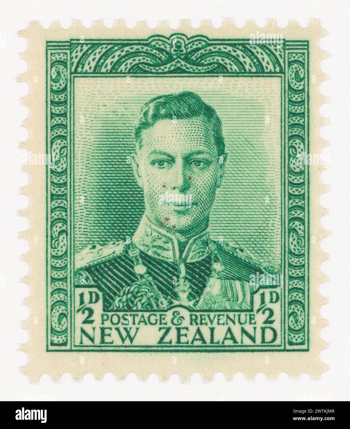 Issued half penny 'King George VI' definitive stamp in green postage stamps Stock Photo