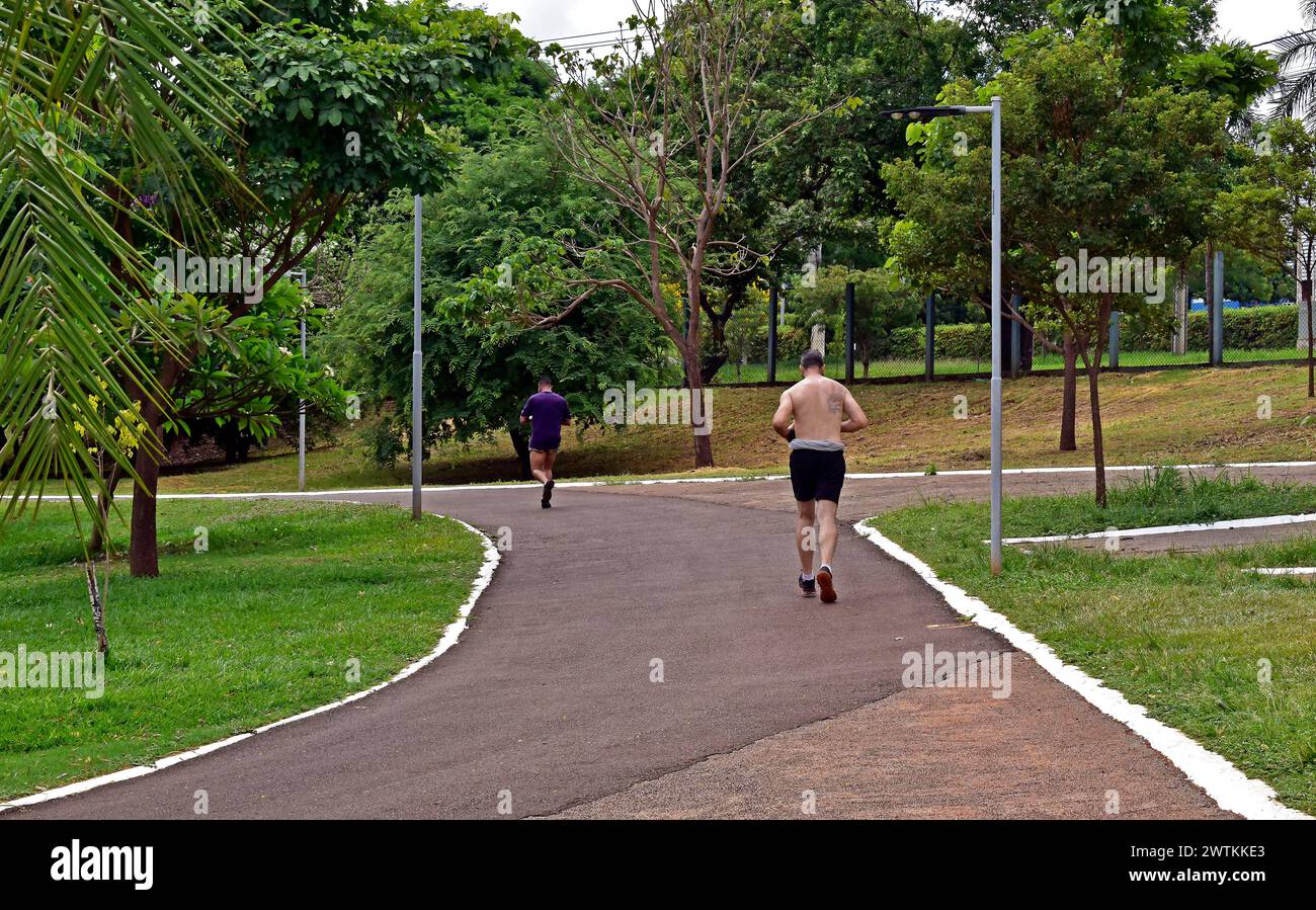 RIBEIRAO PRETO, SAO PAULO, BRAZIL - December 24, 2023: Adult man running on public park Stock Photo