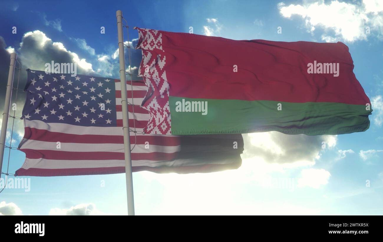 Belarus and United States flag waving in deep blue sky together ...