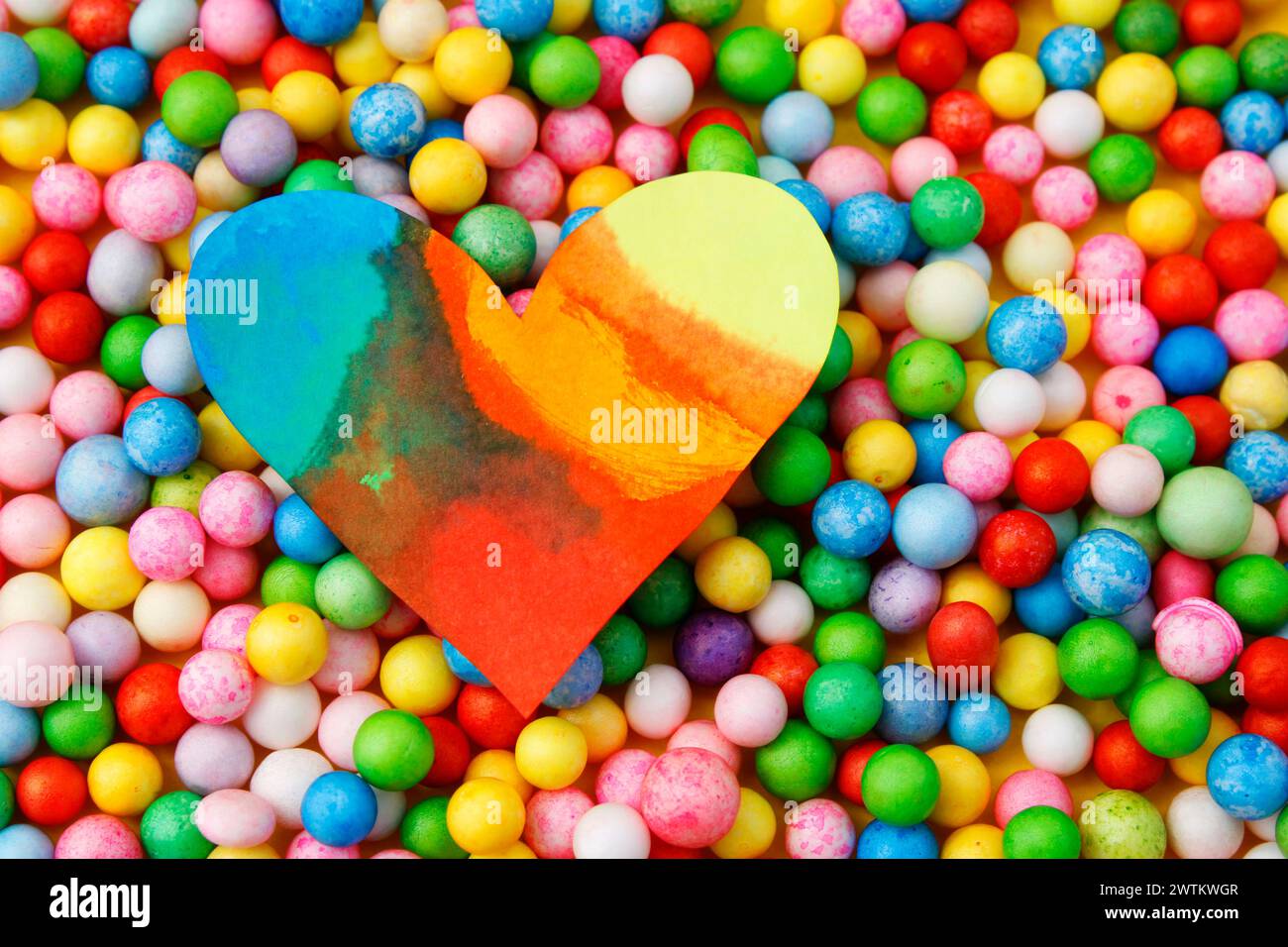 Colorful heart on many different colored spheres Stock Photo