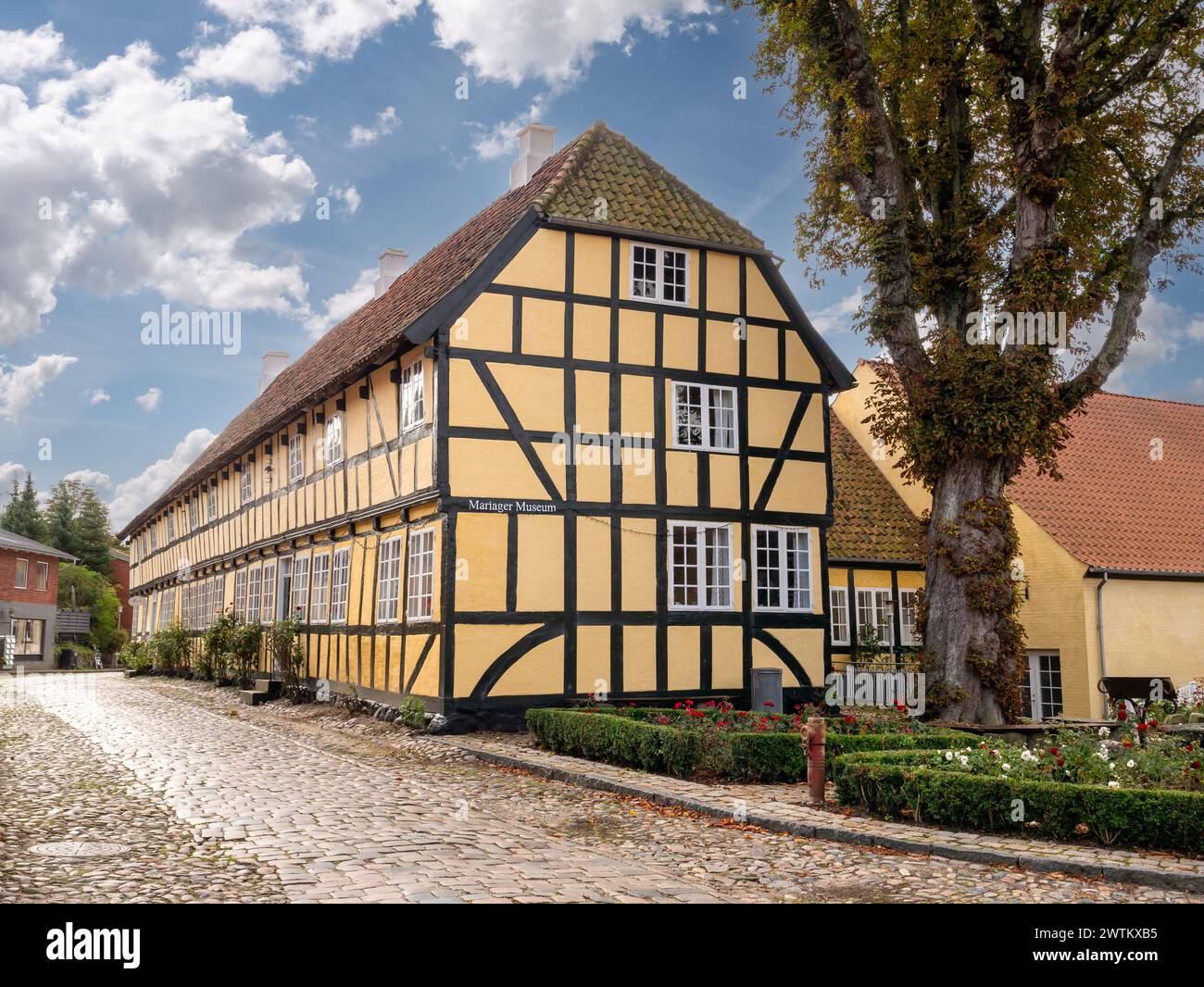 Half-timbered building housing museum along cobbled street in old town ...