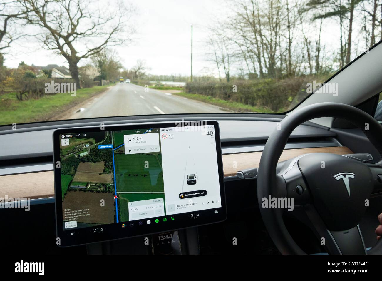 Digital display with Satnav, Tesla Model 3 interior view. Stock Photo
