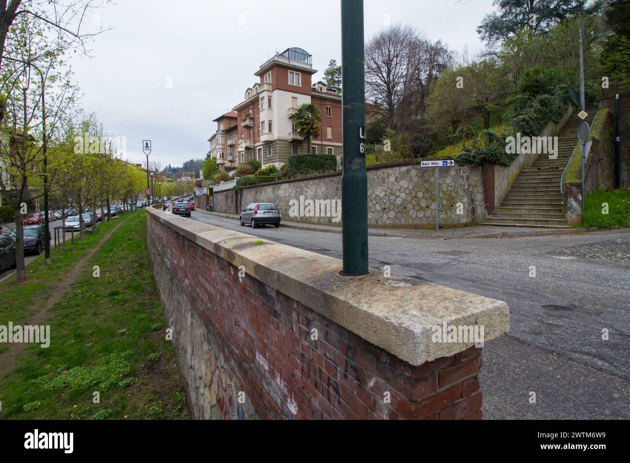 View of Borgo Crimea in Turin, next to the hills, with a road, an elegant building, a path and a stairway Stock Photo