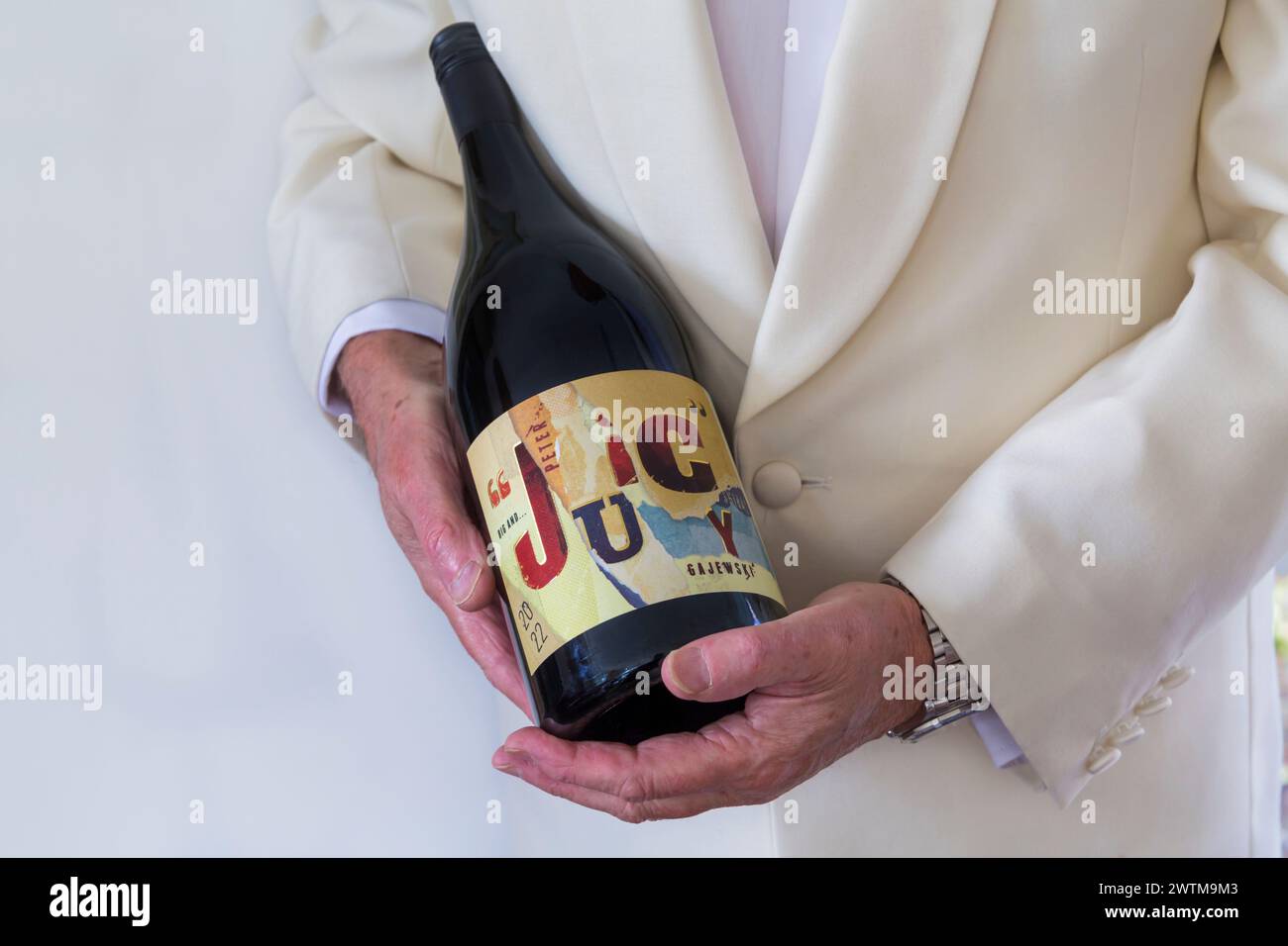 Man carrying magnum of wine hi-res stock photography and images - Alamy
