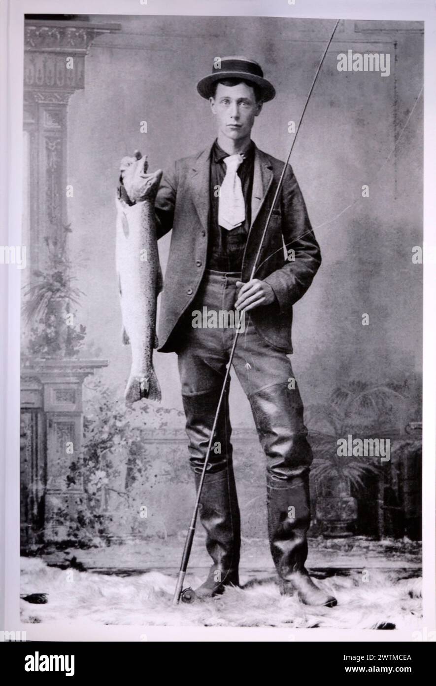 https://c8.alamy.com/comp/2WTMCEA/an-early-1900s-posed-studio-portrait-of-an-american-man-holding-a-fishing-pole-and-a-fish-for-sale-in-an-antique-shop-2WTMCEA.jpg
