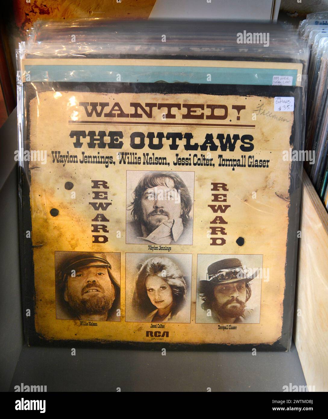 A copy of the 1976 album 'Wanted The Outlaws' featuring Willie Nelson, Waylon Jennings, Jessi Colter and Tompall Glaser for sale in an antique shop. Stock Photo