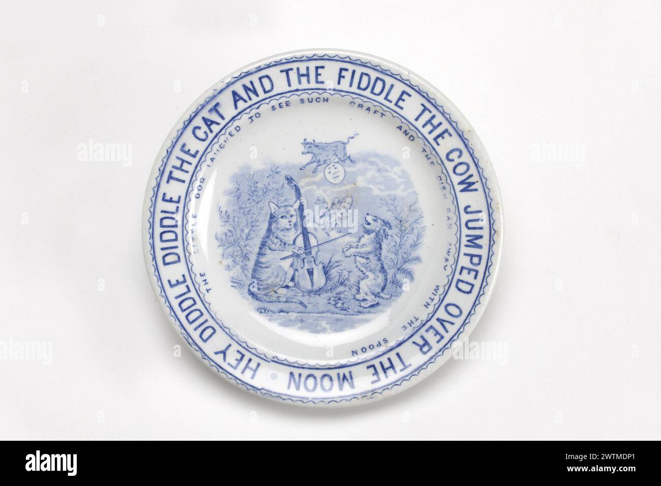 Toy plate - Hey Diddle Diddle the Cat and the Fiddle The Cow Jumped over the Moon The Little Dog laughed to see Such Craft and the Dish Ran away with the Spoon Whittaker & Company, 1886-1892 Whittaker & Company, 1886-1892 Stock Photo