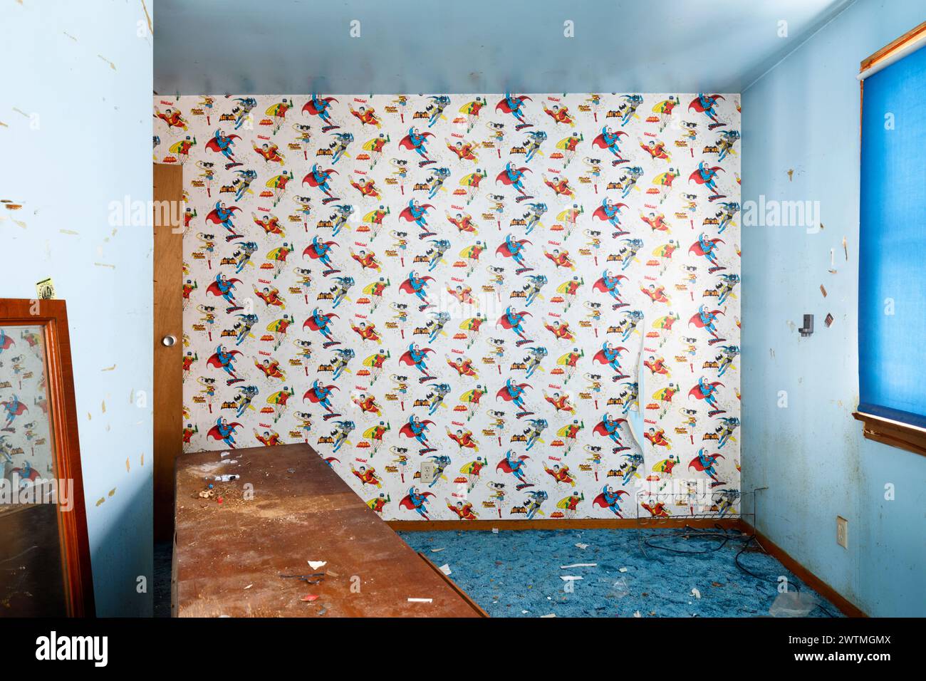 Retro 80s superhero wallpaper in a blue bedroom Stock Photo - Alamy
