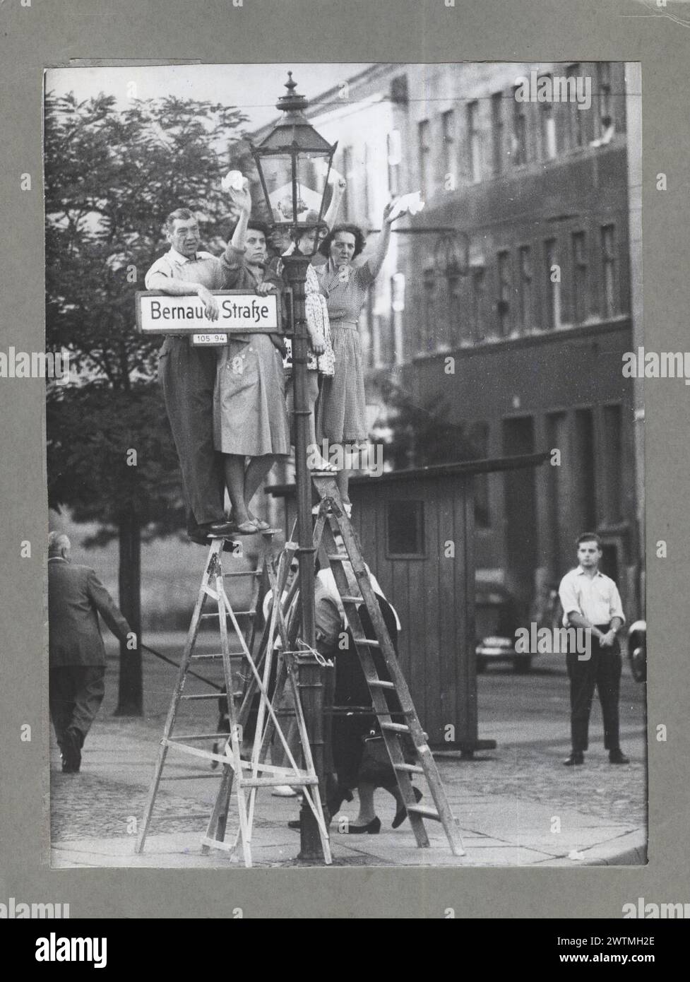Sept. 16, 1961. West Berliners wave to friends and family across the Berlin Wall. From the booklet 'A City Torn Apart: Building of the Berlin Wall.'   Credit: Records of the U.S. Information Agency,, CIA photo Stock Photo