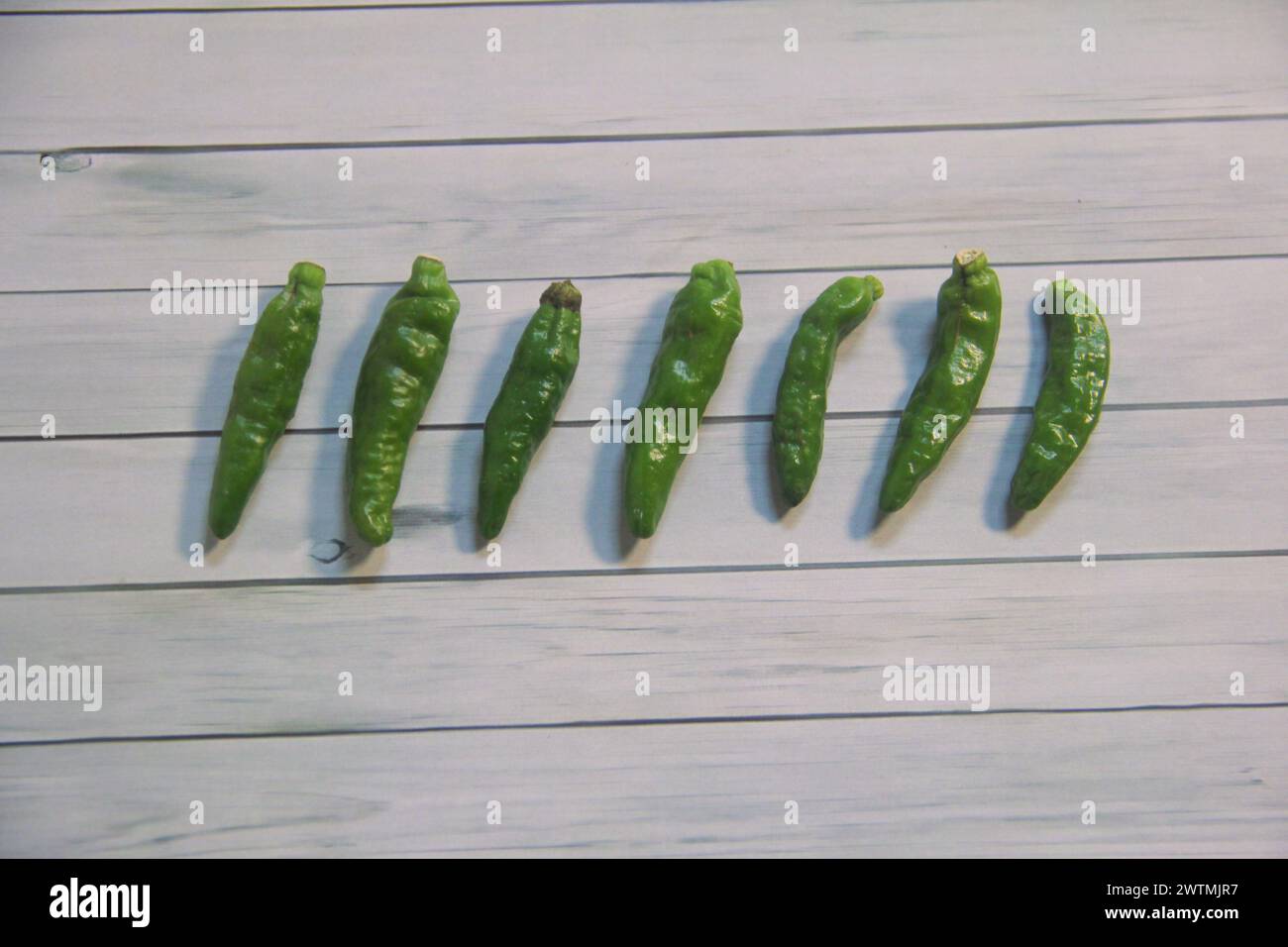 Cayenne pepper in the photo with a textured background Stock Photo - Alamy