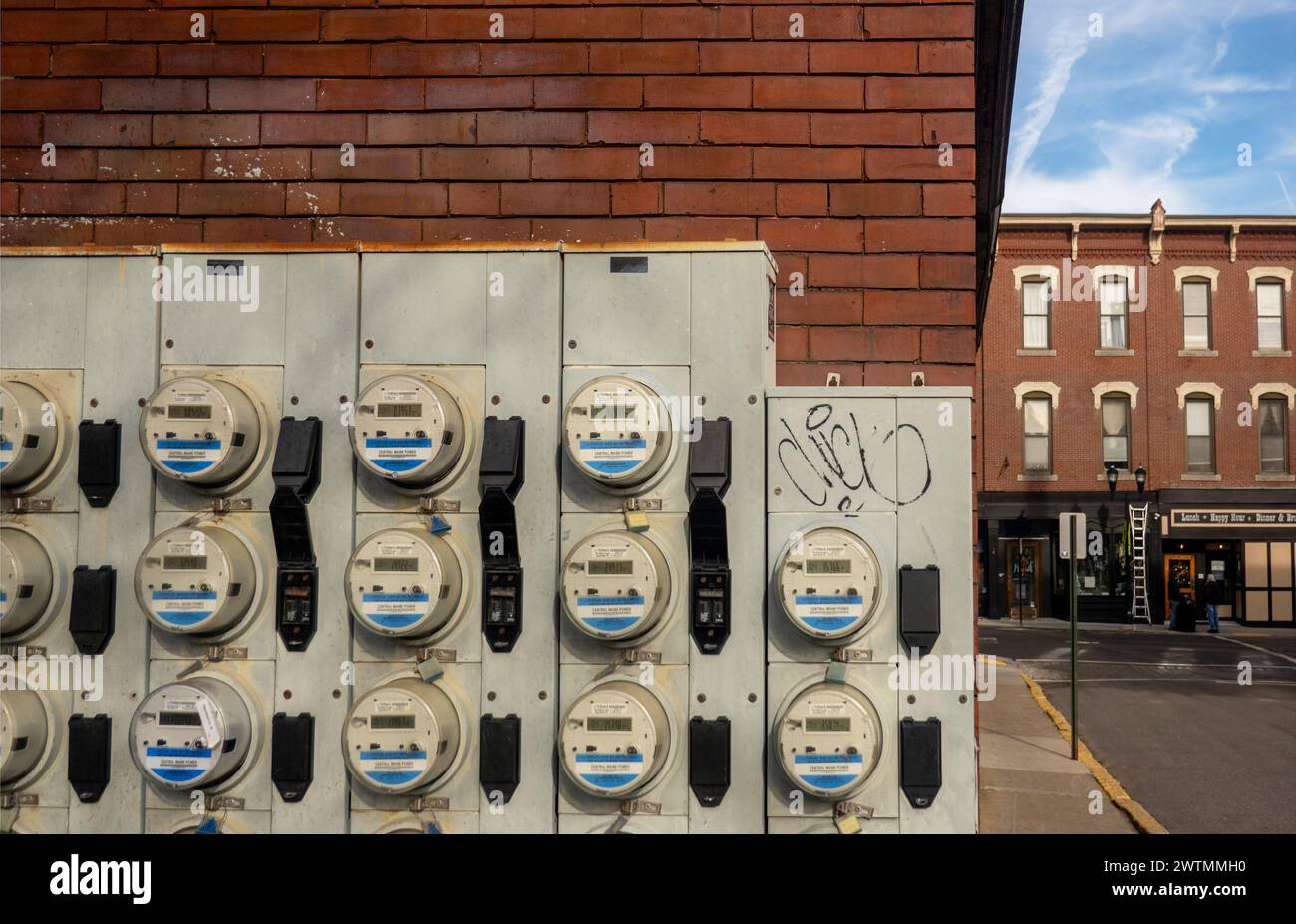 wall of electricity meters for apartments in downtown Biddeford Maine Stock Photo