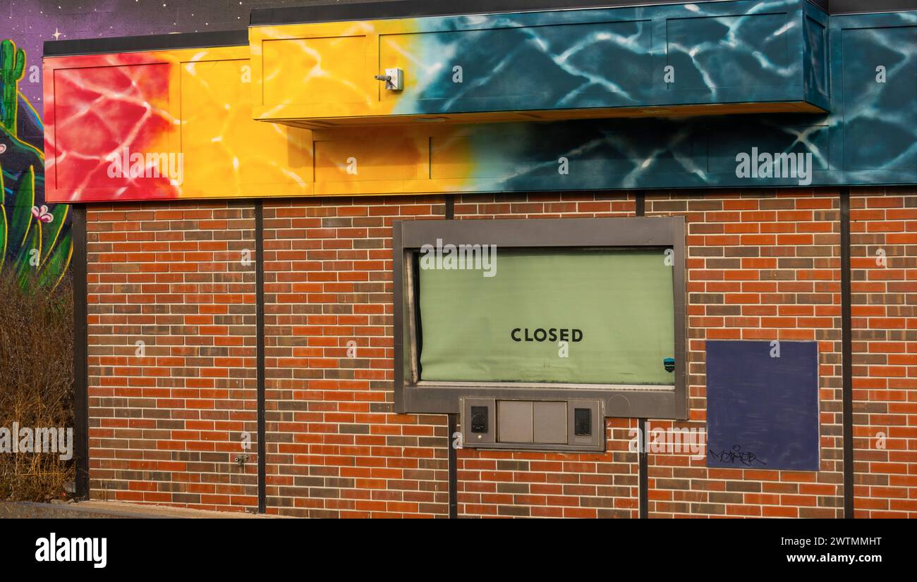 closed sign in a drive thru window of a bank in Biddeford Maine Stock Photo