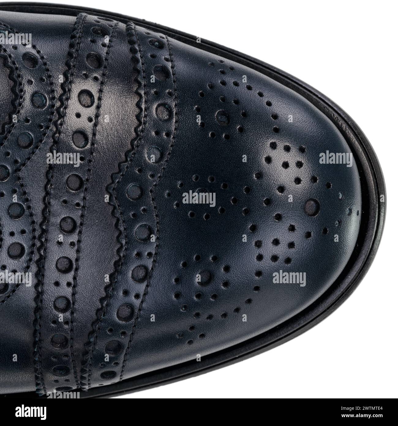 Close-Up of Brogue Detail on Navy Blue Leather Oxford Shoe Stock Photo