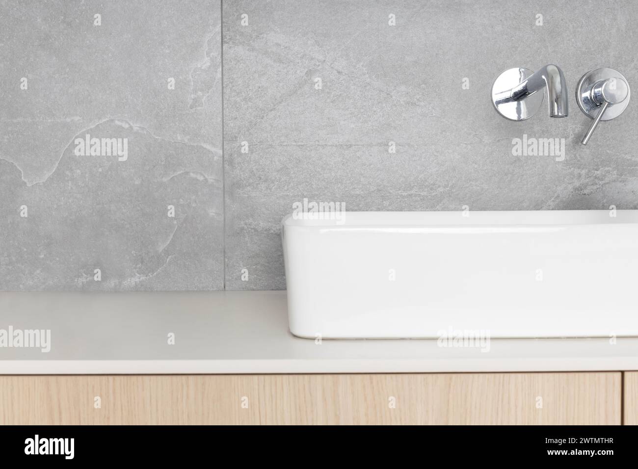 Image showcasing Sleek Modern Bathroom Sink with Wall-Mounted Faucet Stock Photo - Alamy
