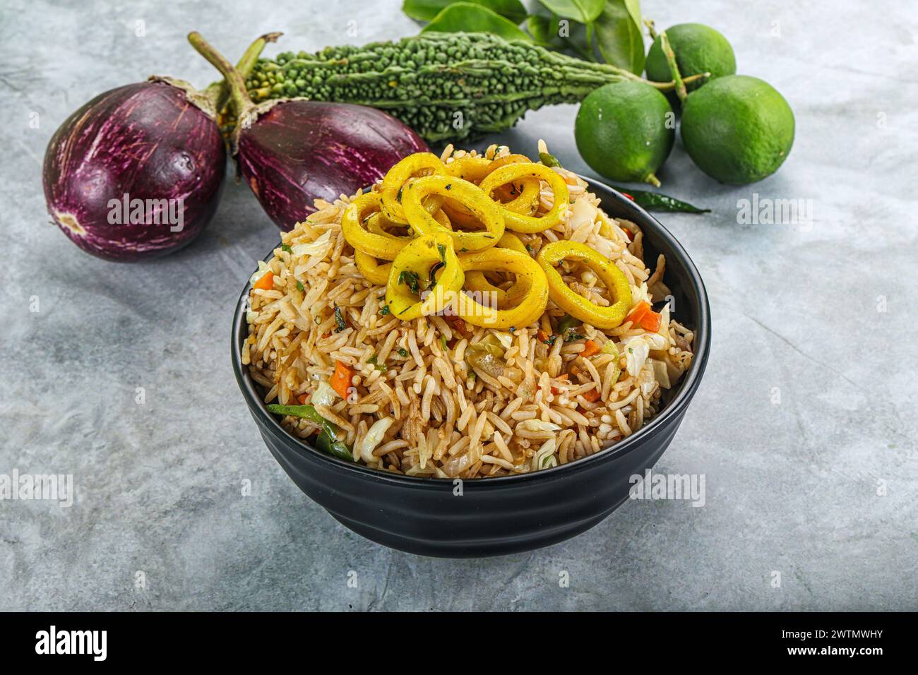 Asian cuisine - Fried rice with squid rings Stock Photo - Alamy