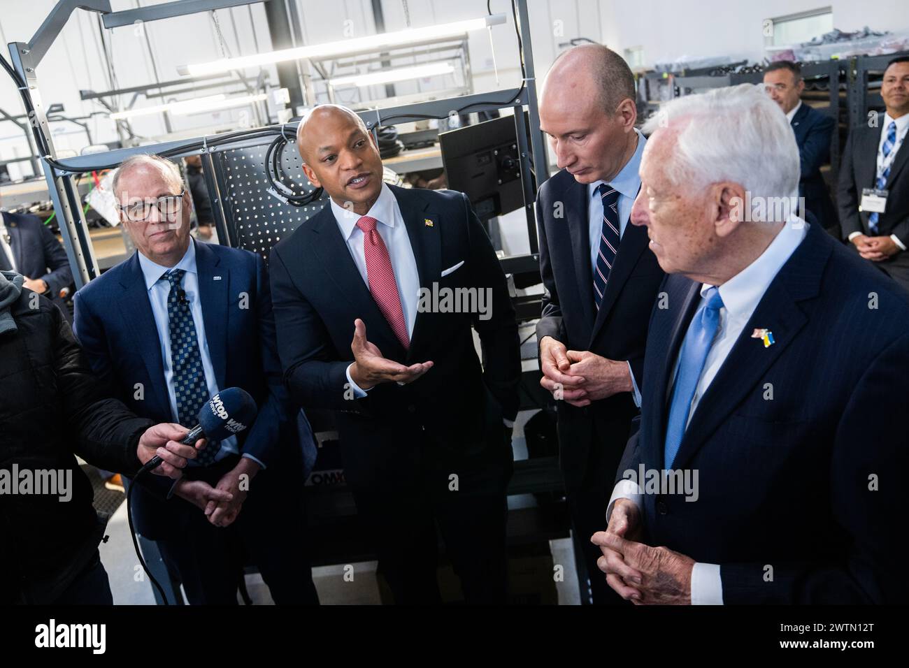 Bowie, United States. 11th Mar, 2024. UNITED STATES - MARCH 11: From left, Blink Charging CEO Brendan Jones, Gov. Wes Moore, D-Md., Deputy Energy Secretary David Turk, and Rep. Steny Hoyer, D-Md. address the media during the grand opening of Blink Charging's new flagship manufacturing facility in Bowie, Md., on Monday March 11, 2024. (Tom Williams/CQ Roll Call/Sipa USA) Credit: Sipa US/Alamy Live News Stock Photo
