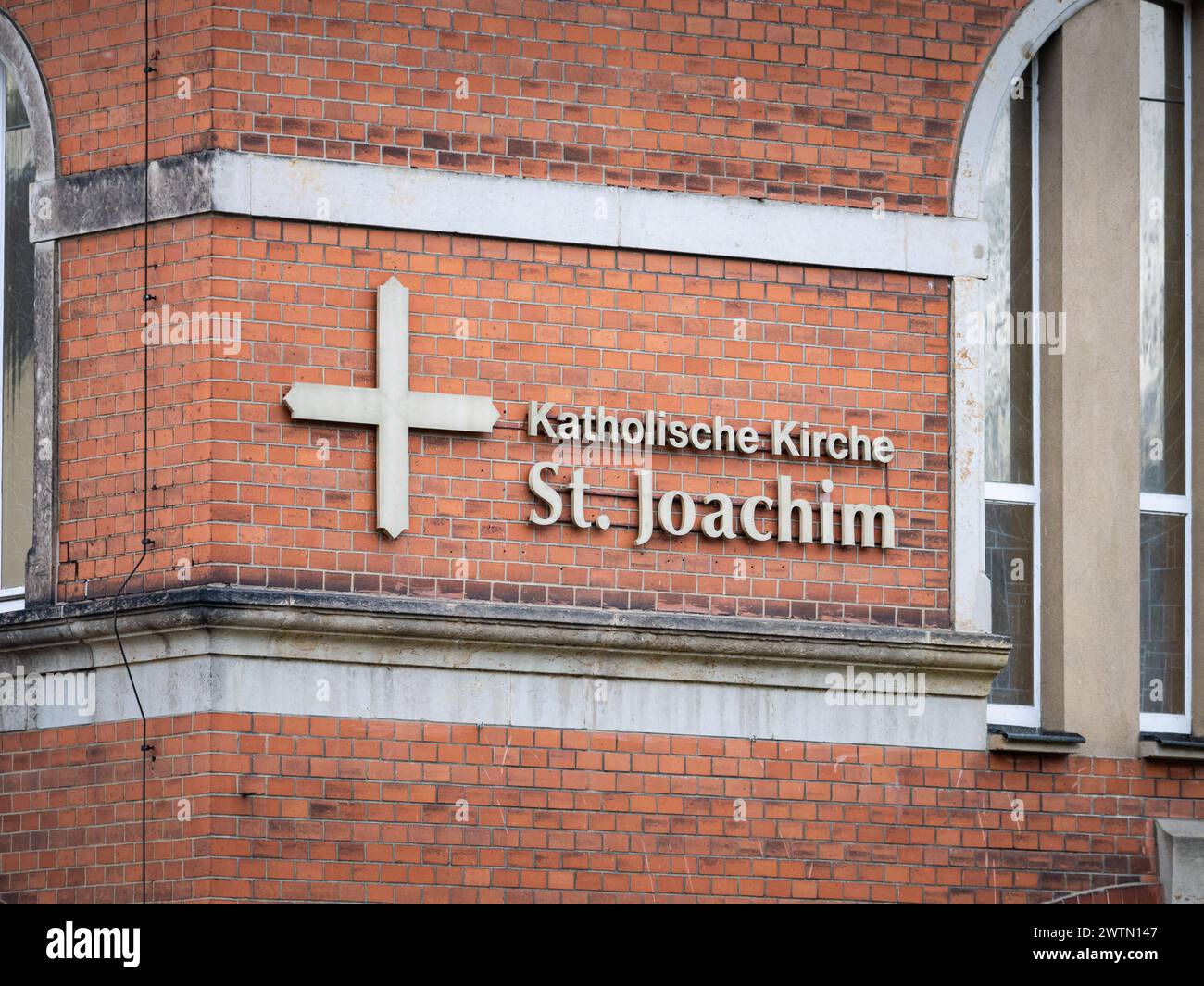 Katholische Kirche St. Joachim (Saint Joachim Catholic Church) logo sign on a building exterior. Christianity is the major religion in Germany. Stock Photo