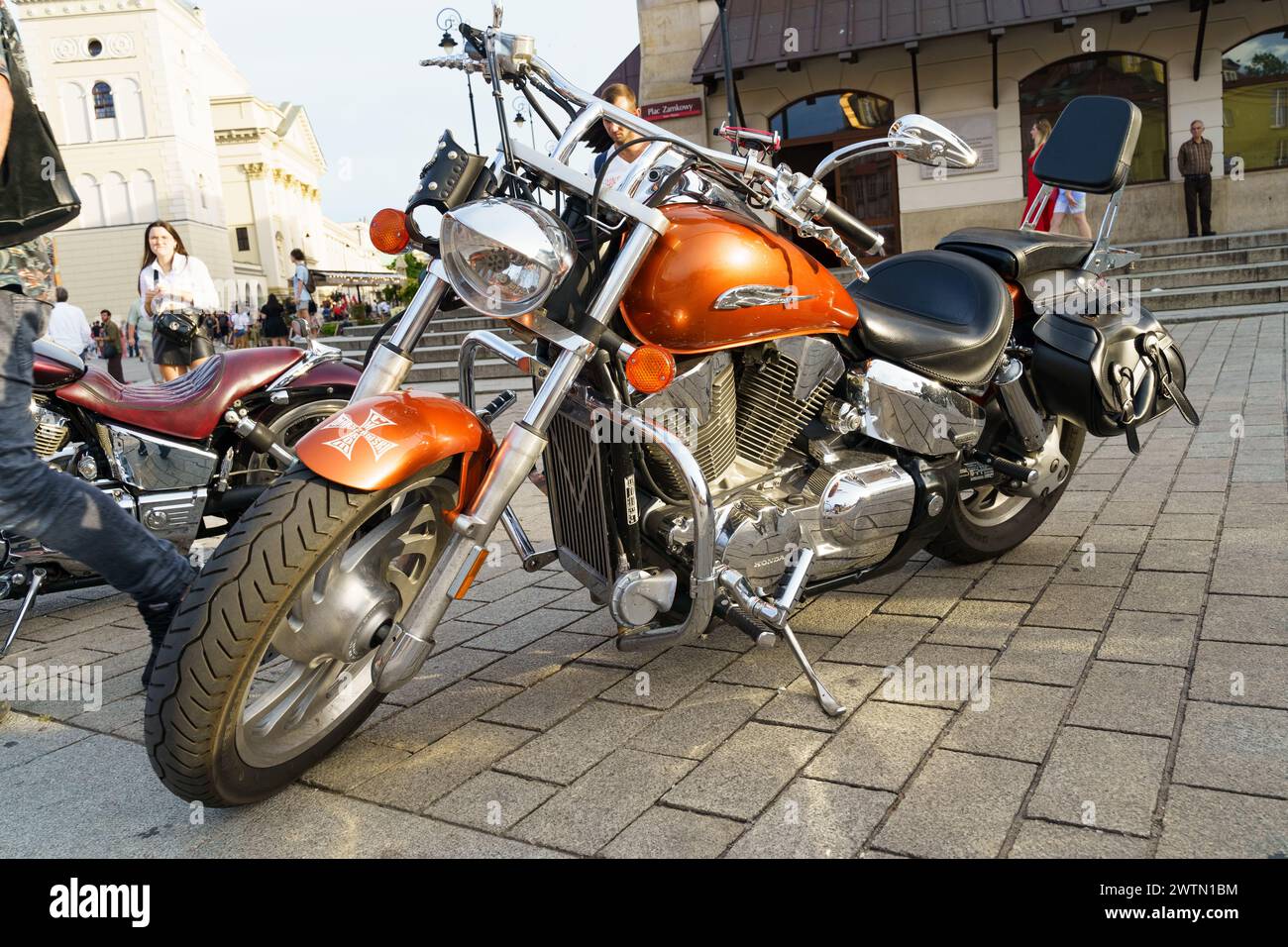 Warsaw, Poland - August 6, 2023: Classic motorcycle Honda VTX 1300. Beautiful chrome-plated orange motorcycle. Stock Photo