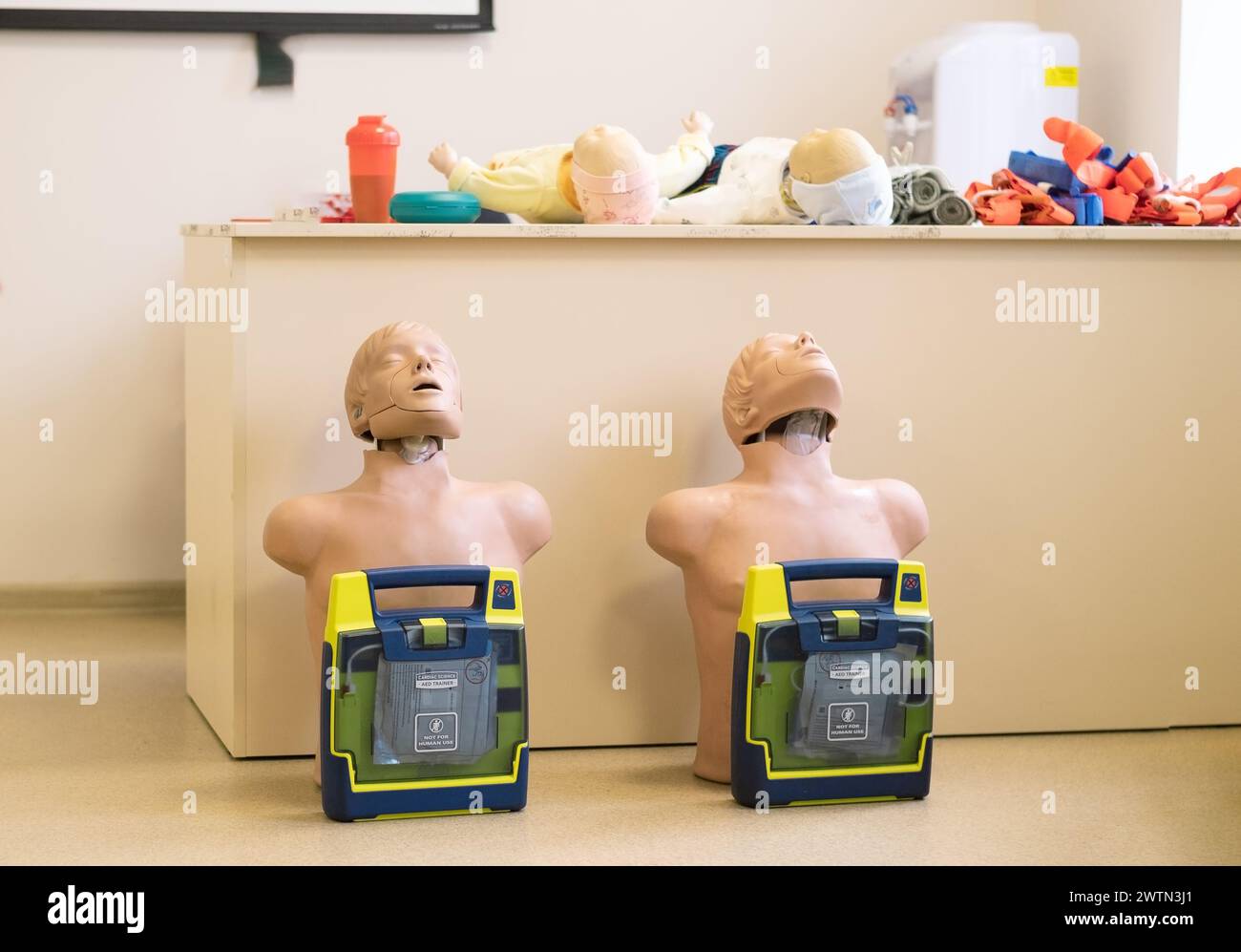 Manikin for demonstration of CPR Cardiopulmonary resuscitation for resurrected patients and Automated External Defibrillator. Stock Photo