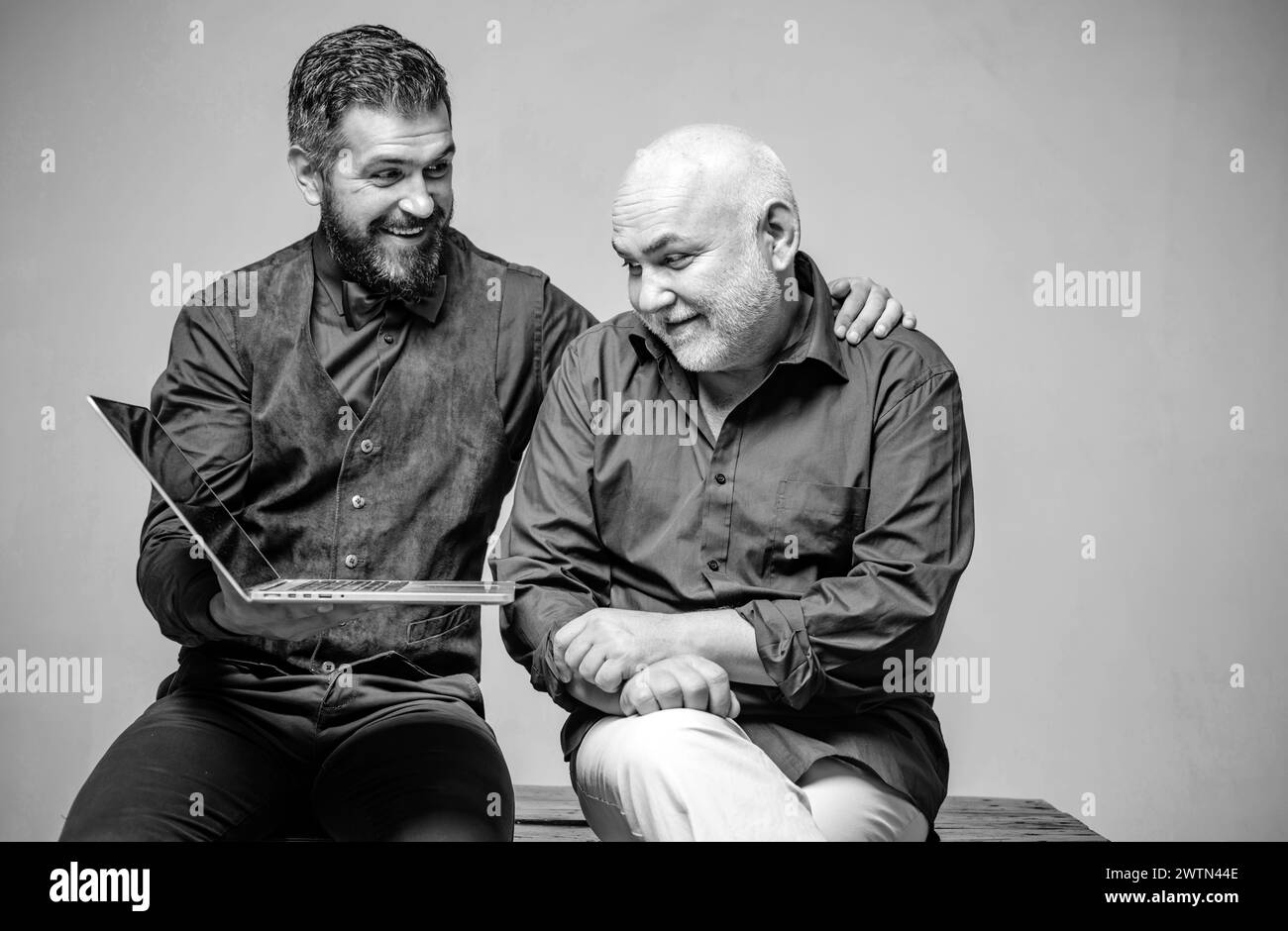 Smiling dad son using Black and White Stock Photos & Images - Alamy