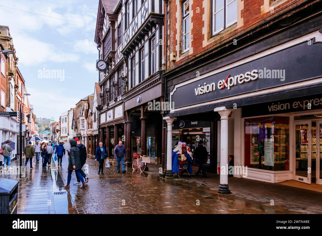The lively High Street in the city center, a rainy day. Winchester, Hampshire, England, United Kingdom, Europe Stock Photo