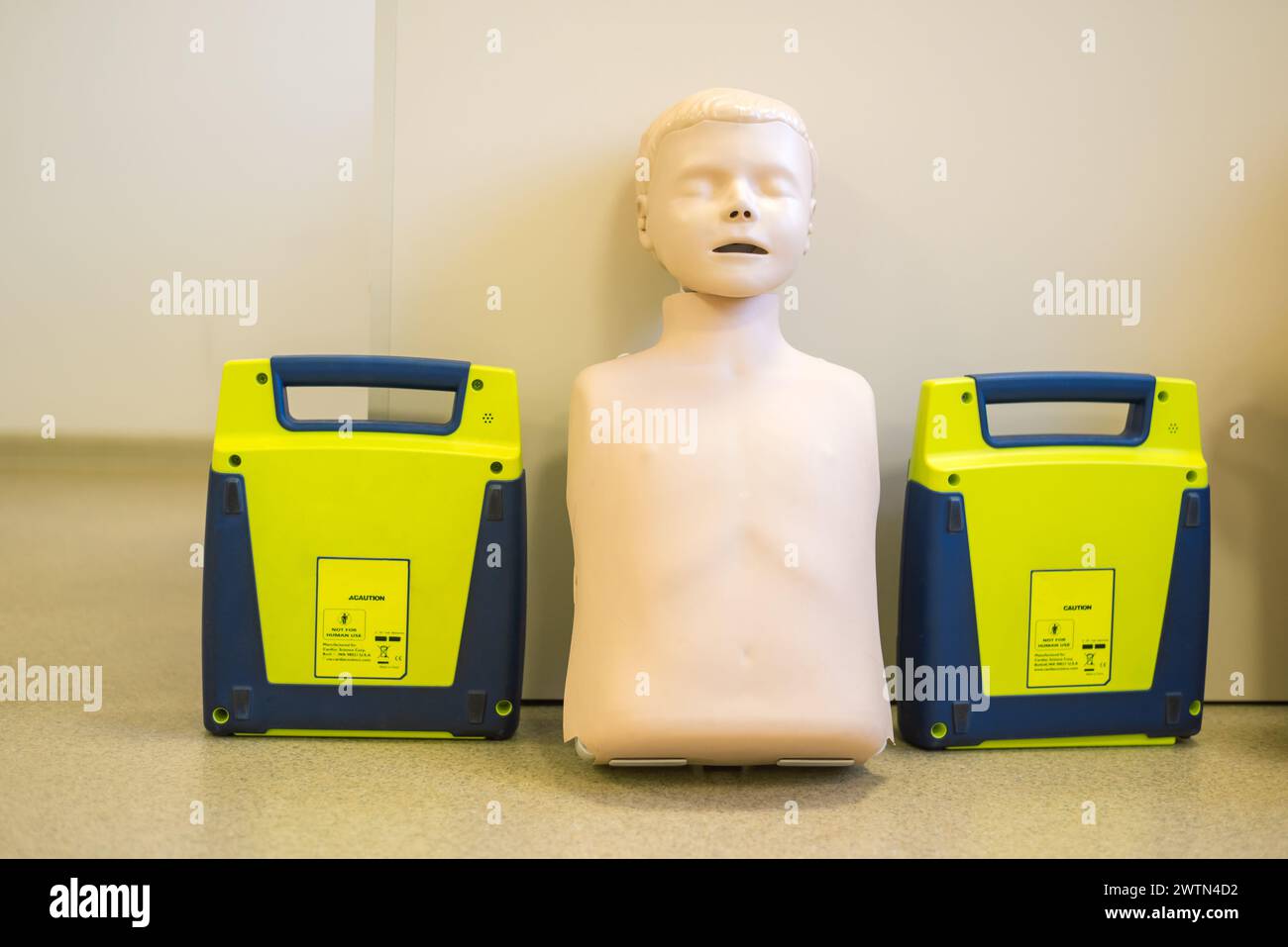 Manikin for demonstration of CPR Cardiopulmonary resuscitation for resurrected patients and Automated External Defibrillator. Stock Photo