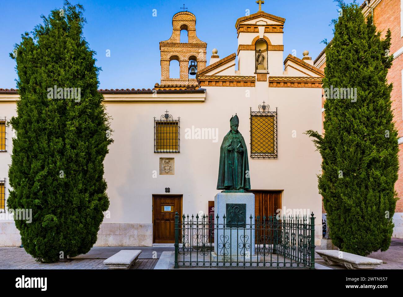 Facade of the Convent of the Poor Clares of San Diego and in the foreground, the monument to Archbishop Alonso Carrillo de Acuña, a Spanish politician Stock Photo