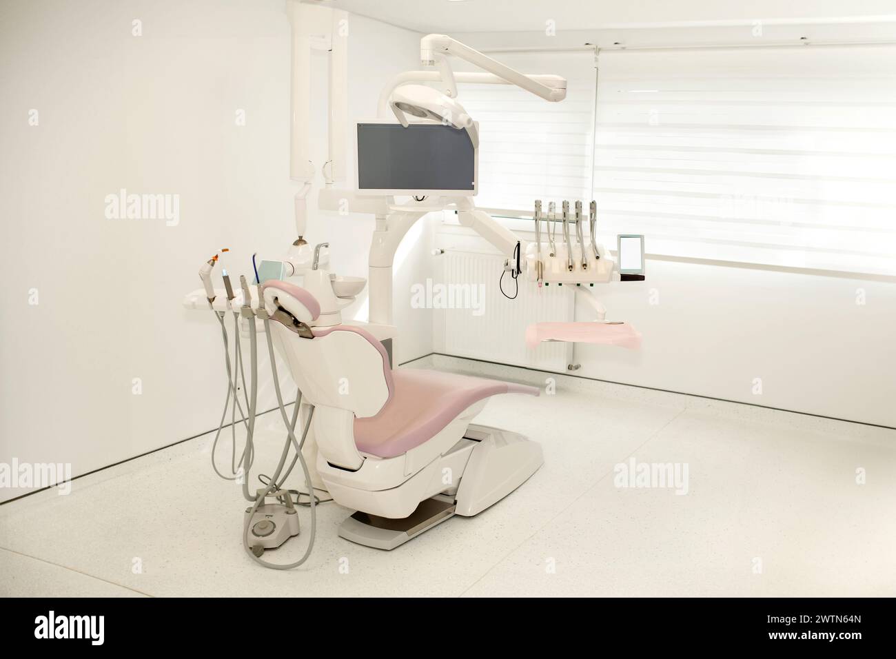 Pink dental chair in a modern dental Stock Photo Alamy