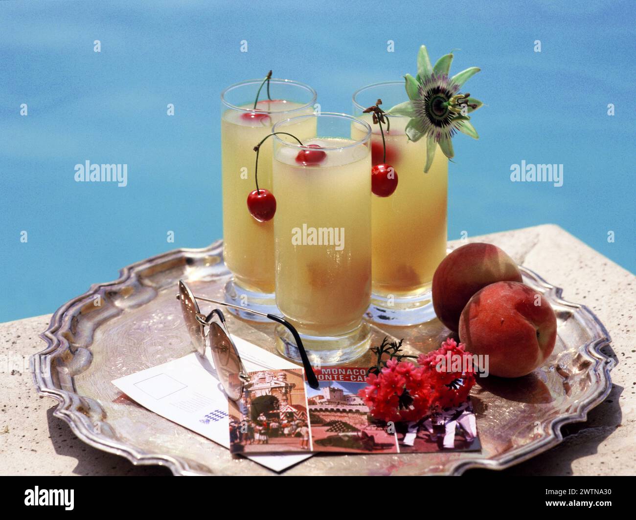 Monaco. Monte Carlo. Drinks on tray by swimming pool. Stock Photo