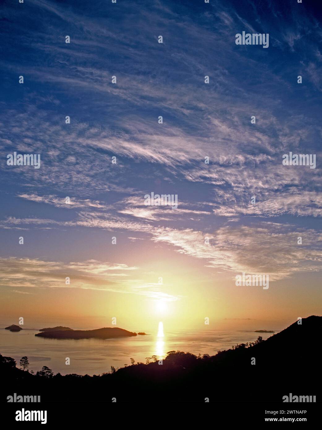 Seychelles. Mahé. Sunrise over the coast with Cerf Island. Stock Photo