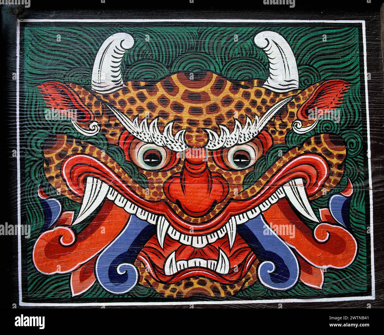 South Korea. Gwangju. Temple door panel painting of demon. Stock Photo