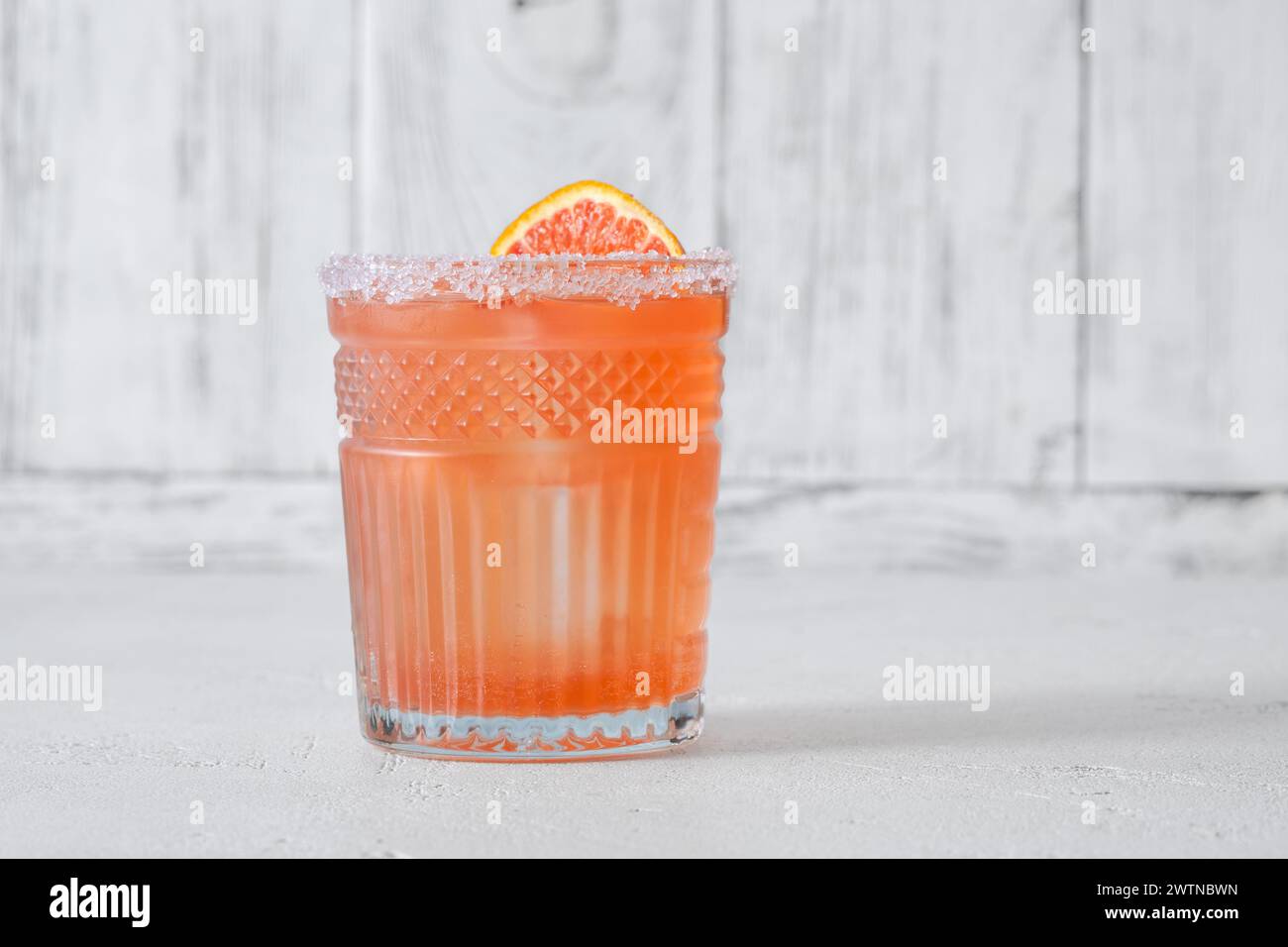Blood Orange Margarita cocktail garnished with orange wheel Stock Photo